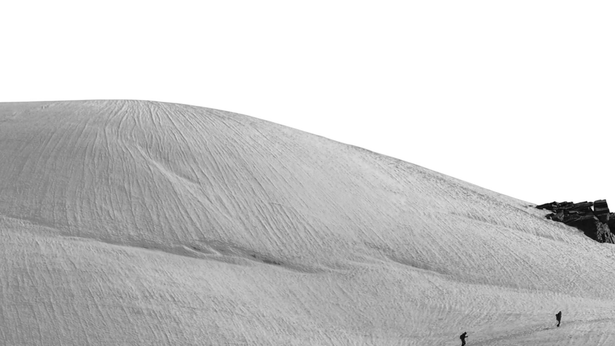 A distant mountain ridge fading into morning haze